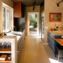 Kitchen offers contrasting dark tone cabinetry and light tone natural wood