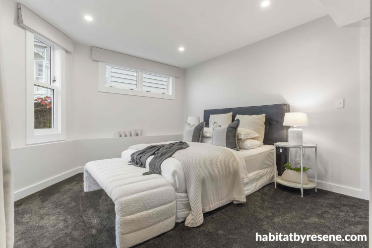 The gentle grey of Resene Wan White on the walls creates a charming and timeless feel in this bedroom, while the skirting and trims in Resene Eighth Black White provide a seamless transition from outside to in.
