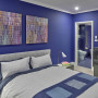 Bedroom with purple walls and white trims creates vibrant atmosphere 