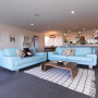 living room, lounge, open-plan, white paint, grey carpet, blue leather sofa