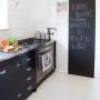 black and white kitchen, black cabinets, white kitchen tiles, blackboard paint, kitchen makeover