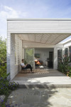 A serene villa adorned in timeless greens and whites