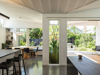 A serene villa adorned in timeless greens and whites A serene villa adorned in timeless greens and whites