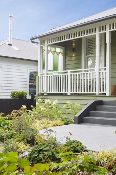 A serene villa adorned in timeless greens and whites