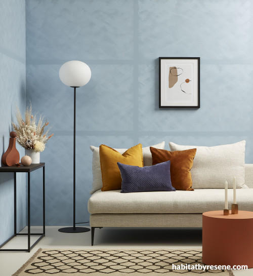 White sofa and blue walls in lounge