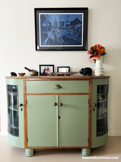 Green cabinet white wall