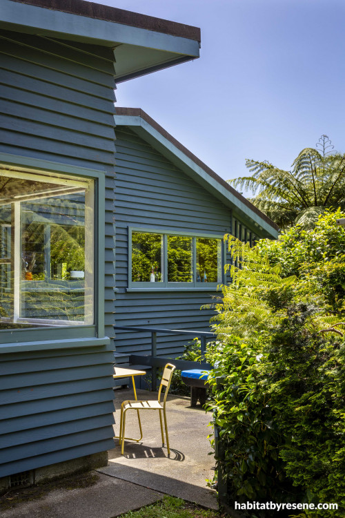 Home exterior in dark blue