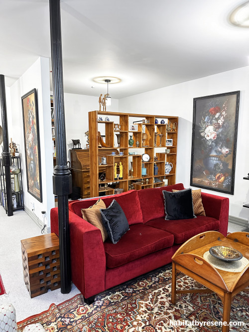 The pops of rich red and brown through décor give a nod to the history of the building.