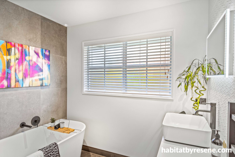 “In the bathroom, Resene Sea Fog was chosen to offset darker grey and black tones while enhancing the effect of white feature tiles,” Charlotte says. The ceiling and trims are painted in Resene Black White.