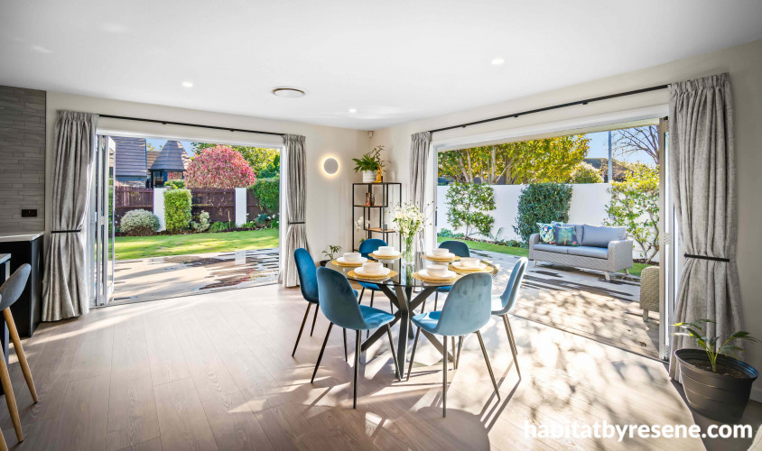 The open-plan dining has a spacious feel and new bi-fold doors allowing light and landscape to pour in.
