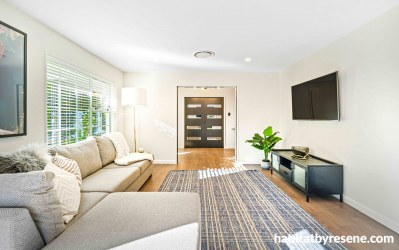 This incredibly inviting living space extends from the rest of the open-plan area, inviting guests to relax and unwind.