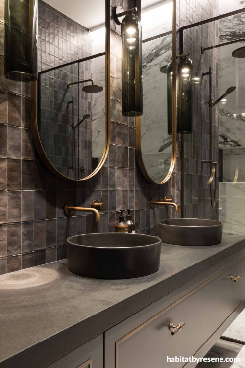 In the exquisite master ensuite, Resene Fuscous Grey was used on the vanity to harmonise with the dark marble and charcoal feature tiles. The ceiling is painted in Resene Alabaster. 