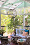 This century-old Brisbane Queenslander is transformed into a tropical oasis with summer green Resene Edgewater and Resene Warrior
