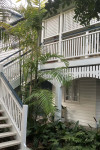 This century-old Brisbane Queenslander is transformed into a tropical oasis with summer green Resene Edgewater and Resene Warrior