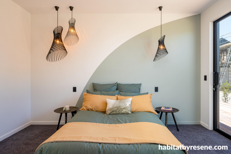 A gentle green hue was used as an alluring statement in the master bedroom