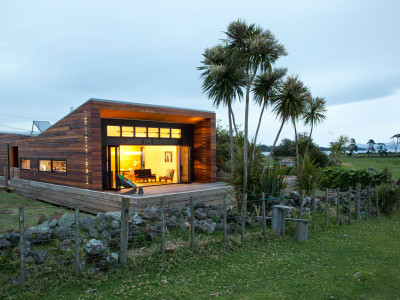 Auckland eco home built from recycled power poles is splashed with vibrant Resene yellows and rocky coast greys Auckland eco home built from recycled power poles is splashed with vibrant Resene yellows and rocky coast greys