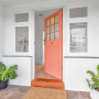 pink door, front of home, pink