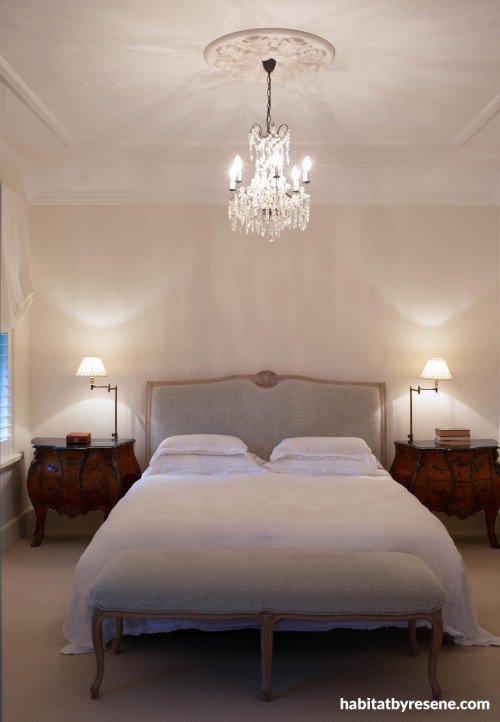 The master bedroom features classic neutrals with charming décor, a space where traditional meets contemporary.