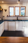 A former sailmaker’s shed becomes a colourful home to a creative family of five 