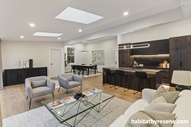 Skylights work to brighten this space naturally and show off the beauty of the oak cabinetry stained in Resene Treehouse. The walls are painted in a gentle neutral, Resene Wan White, doors in Resene Double Wan White and ceiling and trims in Resene Eighth 