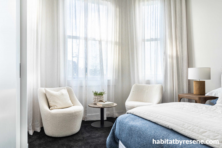 Inviting and comfortable furniture adorns this bedroom, and subtle floating sheer window dressings allow for diffused light, creating a serene atmosphere. Walls painted in Resene Wan White and trims in Resene Eighth Black White. 