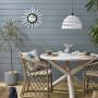 These coastal blue weatherboards are painted in Resene Baring Head, while the deck is stained in Resene Woodsman Uluru.