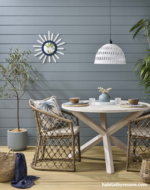 These coastal blue weatherboards are painted in Resene Baring Head, while the deck is stained in Resene Woodsman Uluru.