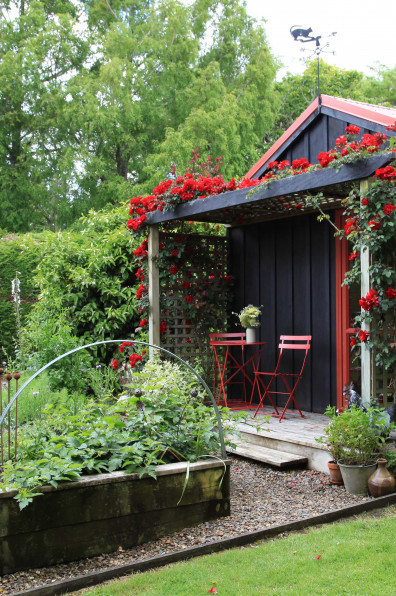 An enchanting cottage garden with a cute-as-a-button Shepherd's Hut
