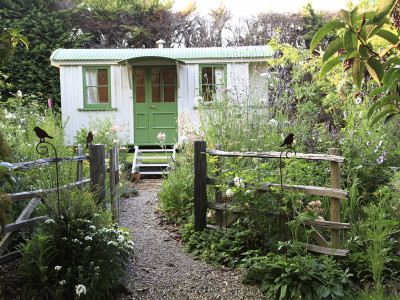 An enchanting cottage garden with a cute-as-a-button Shepherd's Hut