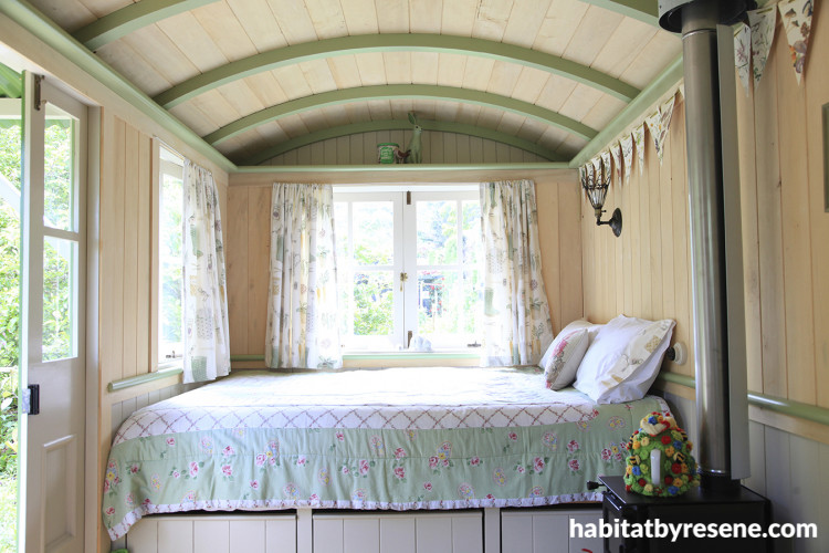 Shepherd's hut in country garden