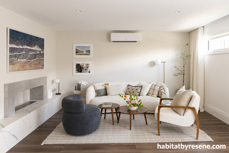 Pops of colour and warmth from art, décor and the wooden flooring give this neutral space the most charming feel.