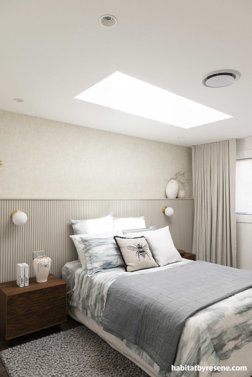 In the guest bedroom, the warm plaster-like finish of Resene Wallpaper Collection