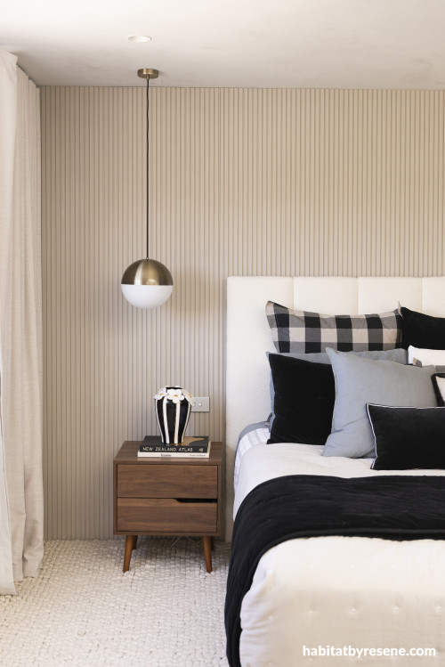 The master bedroom walls are painted in Resene Quarter Truffle