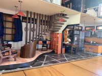 This impressive winning family teeny house features a stained wooden staircase This impressive winning family teeny house features a stained wooden staircase