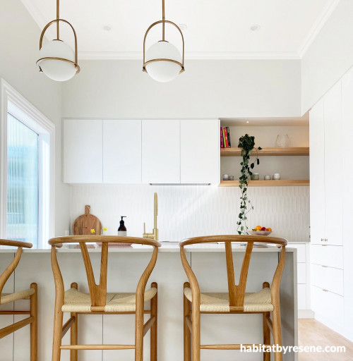 This modern and bright kitchen is painted in Resene Merino, with ceiling and trims in Resene Alabaster.