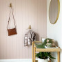 The back entrance tongue-and-groove wall is also painted in the delightful Resene Blanched Pink, creating a sense of continuity from the exterior and the front door.