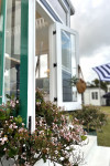 A Hamptons themed tiny home designed by lady tradies creates affordable luxury