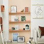 white wall peach bookshelf