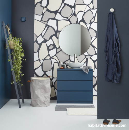 The back wall of this powder room is in Resene Jaguar with painted ‘faux’ terrazzo in Resene Alpaca, Resene Urbane and Resene Tom Tom. 