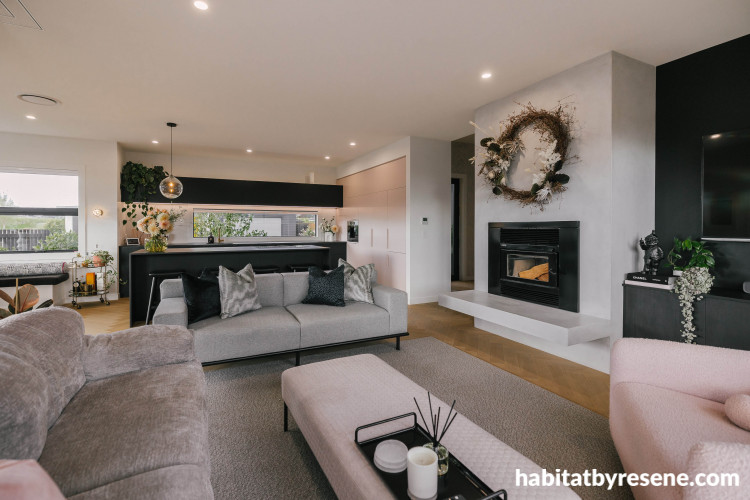 Dusty pink tones adorn the furniture white room is painted white