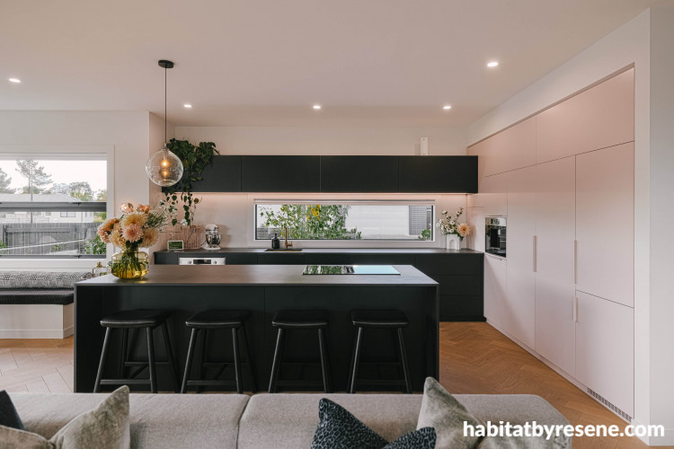 Dusty amber toned pink stands in perfect contrast to the black toned joinery.