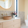 Golden cream tone creates mellow and relaxing bathroom space