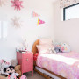 Soft peach tone on bedroom walls and white tone on ceiling