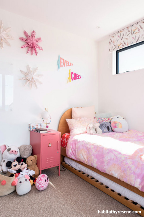 Soft peach tone on bedroom walls and white tone on ceiling