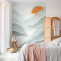 Wallpaper with light green tones brightens bedroom space