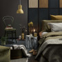 Moody bedroom painted in dark brown tone creates mystical atmosphere