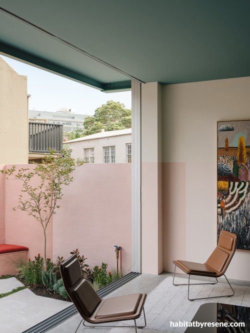 Indoor living area and outdoor area painted in Resene Soft Pink and Resene Serenade
