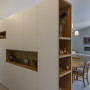 Open plan space with room divider featuring Resene Emerge