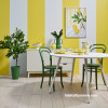 Dining room painted in yellow and white stripes featuring Resene Quarter Spanish White and Resene Energy Yellow