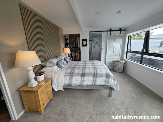 Bedroom with feature wall in Resene Half Pravda and timber slat headboard